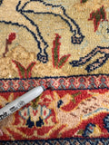 Antique Persian scatter rug showing cotton warp and weft.