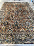 Vintage Persian Kerman rug featuring interconnected vine work design.