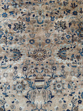 Vintage Kerman rug floral sprays across neutral ground.