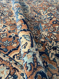 Soft, velvety wool texture of antique Persian Kerman rug.