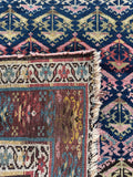 Textural close up of underside of antique Persian rug.