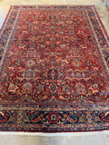 1920s Persian Mahal rug with deep midnight blue border.