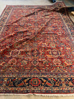 Handwoven wool rug showing intricate all-over design.