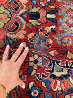 Worn area showing wool loss on a sturdy rug.