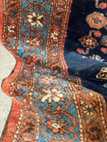 Persian Malayer rug showing dainty floral border bands.