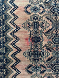 Vintage Malayer rug natural dye variation blush tones close up.