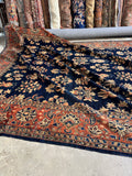 Large scale Persian Sarouk rug with all over design and soft movement.