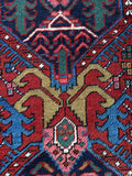 Angular botanical motifs in Persian Heriz runner.