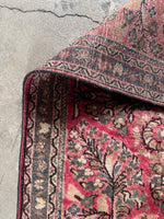 Underside view of 1930s Persian Sarouk rug in nice condition with sheen.