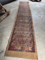 Vintage Persian runner with floating medallions on a camel ground.