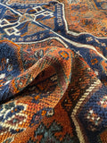 Handwoven Persian Shiraz rug with a floppy handle and beautifully aged character.