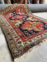Handwoven tribal rug with saturated vegetable dyes.