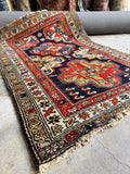 Handwoven tribal rug with saturated vegetable dyes.