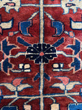 Red ground detail with brilliant natural dyes and strong contrast.