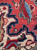 Ivory spandrel corner motif rug close-up illustrating the contrasting off-white corners with stylized botanical accents.