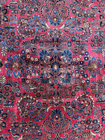 Antique rug with French blue, pink, and sage green details