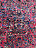 Antique rug with French blue, pink, and sage green details