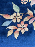 Antique Art Deco rug with diagonal ombre floral motifs on a royal blue field.