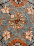 Close-up of antique Persian Tabriz rug showing finely woven floral lattice pattern and original vegetable dyed wool.
