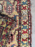 Authentic antique Caucasian rug with rare yellow field, hand knotted tribal wool rug full of character and old rug charm.
