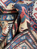 Underside view of antique geometric Kazak runner rug with bold Caucasian tribal design.