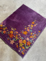 Diagonal angle showing open field and corner floral motif.