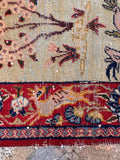 Rare antique Tabriz mat showcasing animal and floral motifs with in the main border band.