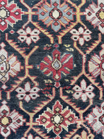 Close up view of nomadic woven Caucasian rug from the early 20th century.