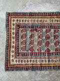 Fence of security border design on an antique Mahal runner.
