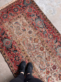 Wide antique Persian runner with a narrow ivory center field and intricate artisan detailing.