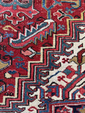 9x12 antique red Persian rug, Heriz medallion rug with rugged mountain village design from Northwest Persia.