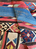 Authentic 1920s kilim rug showcasing fine flatweave wool craft with vibrant natural dyes.