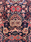 Narrow 4x9 vintage Persian runner detail shot showing historical narrow-cut seam and professional reassembly.