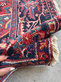 Large red Persian rug. Antique Heriz wool carpet with navy field, ivory corner spandrels, vegetable dyes, and exceptional craftsmanship.