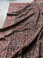 Soft wool Mahal rug in blush, berry red, and espresso brown