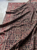 Soft wool Mahal rug in blush, berry red, and espresso brown