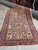 Welcoming small Persian rug with warm and inviting character.