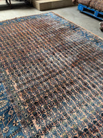 Detailed shot of Persian Sarouk wool nap with color-shifting sheen based on orientation