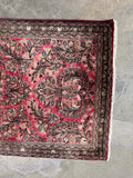 Antique floral Sarouk rug with classic Persian craftsmanship.