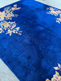 Royal blue Art Deco rug from China with heavy-duty wool construction.