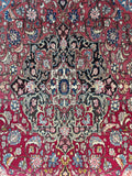 Rare antique Ferahan rug close up view featuring balanced medallion design and aged vegetable dye hues.