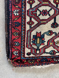 Corner of the rug showing a small nip.