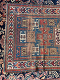 Antique Kazak runner with visible color band variations from natural vegetable dye batches.