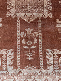 1920s antique Agra carpet close up detailing heavy wool construction and dense weave quality.