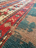 1900s Caucasian mountain rug with floppy handle and natural vegetable dyed yarns.