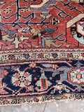 Turtle border motif Persian rug side view detailing the fine hand-knotted stitching along the edge and selvedge.
