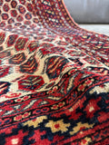 Small antique scatter rug made from durable weighted vegetable dyed wool.