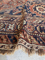 South Persian Shiraz rug with antique ivory, blush, inky blue, and hunter green accents.