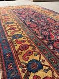 Close-up of saffron yellow border on antique Persian Bidjar rug.