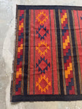 Vintage Anatolian tribal kilim featuring bold geometric motifs and rich abrash throughout the wool.